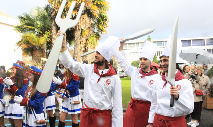 With an umbrella and under a dark sky...